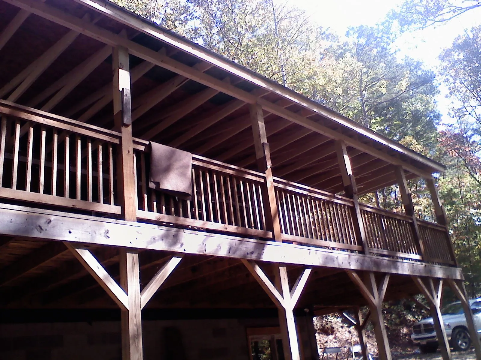Timber framing under a new elevated porch and deck — Roof Leak Repair in Gratiot by Roofing Brothers